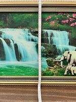 Close-up of the waterfall section and elephants on right with measuring tape for scale.