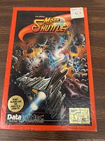 Front of the Moon Shuttle boxed game showing official artwork, Atari compatible 400/800/1200X, 16K diskette & cassette.