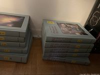 Stack of 10 hardcover books titled 'The Book of Popular Science', arranged in two stacks, showing numbered spines from 1 to 10.