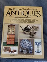 Front cover of The Collector's Encyclopedia of Antiques book showing various antiques