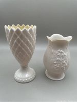 Front view of both vases side by side showing their heights and detailing