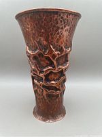 Front angled view of the Brutalist hand hammered copper vase showing the hammered texture and unique raised seams.