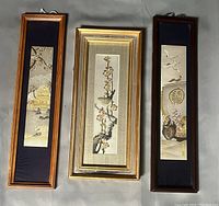 Three framed Japanese Chokin plaques laid flat showing dimensions and design details.