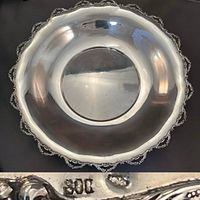 Top-down view showing full round shape and scrolled rim detail