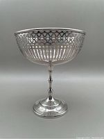 Full front view of the pierced pedestal bowl