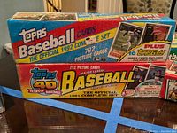 Two sealed rectangular boxes stacked on each other, Topps 1991 and 1992 baseball card complete sets.