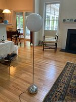 Full view of lamp in room showing overall height and design