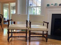 Two armchairs side by side in living room setting front view