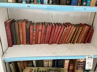 Full shelf view of cloth-bound hardcovers