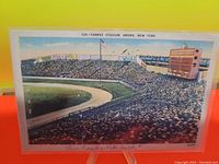 Front side of vintage 1945 Yankee Stadium postcard showing a full stadium with fans and the field view.