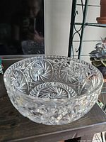 Clear crystal bowl showing detailed pinwheel and crosshatch cut design on the exterior and interior.