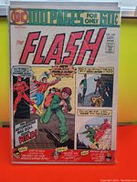 Front cover of The Flash #229 comic book from 1974 showing colorful artwork featuring The Flash, Golden Age Flash, and Green Lantern with various action scenes and text highlights.