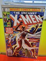 Front cover photo of The Uncanny X-Men #147 comic book showing characters Rogue and Storm with a Marvel Comics Group banner and issue details including price 50 cents, date July, and issue number 147.