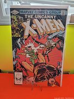 Front cover of The Uncanny X-Men issue #158 comic book in protective sleeve showing colorful action scene and Marvel Comics Group branding.