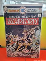 Front cover of Warlord #1 comic book by DC Comics dated 1976, showing action-packed fantasy battle scene