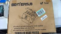 Box showing BetterSub brand and model as a Tumbler Heat Press, teal color indication, and usage cautions.