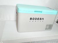 Exterior closed view of grey and sky-blue Bodega cooler showing brand logo on side