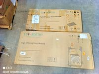 Two Eco-Worthy High Efficiency Solar Module boxes on warehouse floor