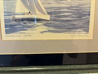 Close-up of the print showing the sailboat on water with a coastal town and church steeple in the background. Signed and numbered 638/950 by Robert Kennedy.