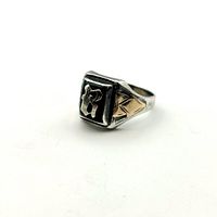 Ring angled on white background showing profile and gold accent on side