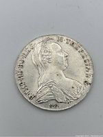 Front side of the 1780 sterling silver coin showing a bust of Maria Theresa with inscriptions.
