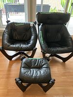 Front view of two chairs and ottoman assembled