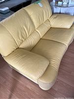 Front three-quarter view showing seat, arms and back