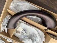 Curved tub filler in box with packaging visible