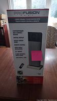 Front view of the unopened ProFusion ceramic tower heater box showing product features and branding.