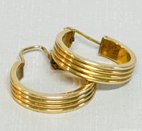 Two hoop earrings stacked to show ribbed design