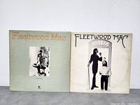 Two Fleetwood Mac album covers side by side, green sleeve and off-white sleeve, showing front designs.