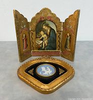 Front view of both Florentine triptych panel open and Wedgwood medallion plaque in front
