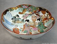 Top angled view showing colorful hand-painted scene with Asian women, floral and natural motifs, and gold accents.