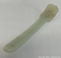 Full view of the jade hairpin showing its length and shape