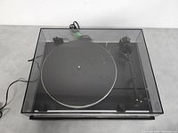 Top-down view of Thorens TD-316 turntable with clear dust cover closed
