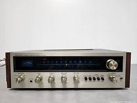 Front view of the Pioneer SX-525 stereo receiver showing all control knobs and tuner.