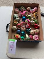 Full box showing an assortment of 31 smaller size vintage glass Christmas ornaments with varied shapes and colors.