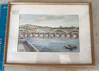 Framed watercolor artwork depicting Scottish bridge scene showing entire frame, matting, and painting.