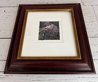 Front view of the framed painting showing the artwork, mat, and frame.