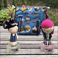 Blue Harajuku Lovers Nerds Rule crossbody bag with two Harajuku Lovers character perfumes Love and Music in front.