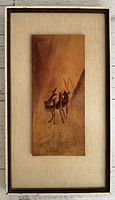 Framed leather artwork of deer signed Endel Ruberg, mounted on linen background, minor wear on frame and linen mat.