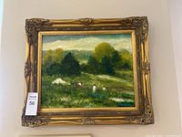 Full front view of framed painting showing ornate carved gold-tone frame and artwork