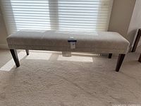 Front view of full-length bench against window