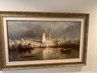 Full front view of framed painting showing bridge over river and city skyline