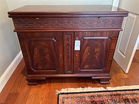 Front view of closed server showing carved drawer and cabinet doors
