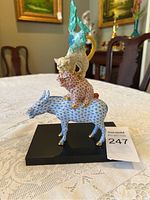 Front view of Herend Bremen Town Musicians figurine showing all four animals stacked on black base.