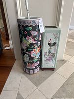 Front view of cylindrical umbrella stand and rectangular plant stand side by side