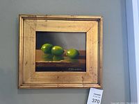 Full view of framed painting hanging on wall