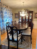 View of full dining table with eight chairs in dining room