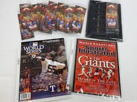 Sports Illustrated Giants 2010 commemorative magazine, 2010 MLB World Series official program, sealed gold plated quarter collections and display binder